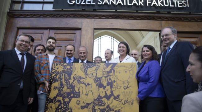 Bakandan AB Komisyoneri'ne resim hediyesi
