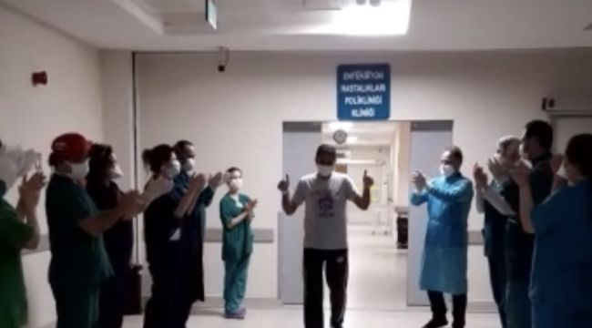 Koronayı yenen sağlıkçı alkışlarla uğurlandı