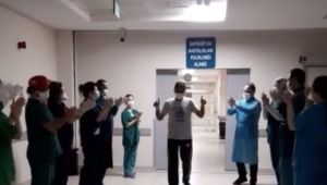 Koronayı yenen sağlıkçı alkışlarla uğurlandı